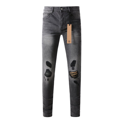 Urban Gray Ripped Jeans with Bold Black Graffiti Accents 3003