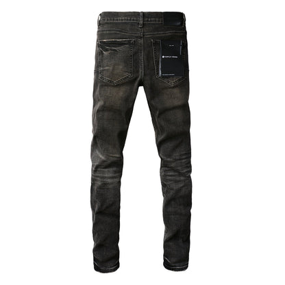 Pantalon en denim noir chic et vieilli 9080 combinant déchirures et patchs pour un style moderne 